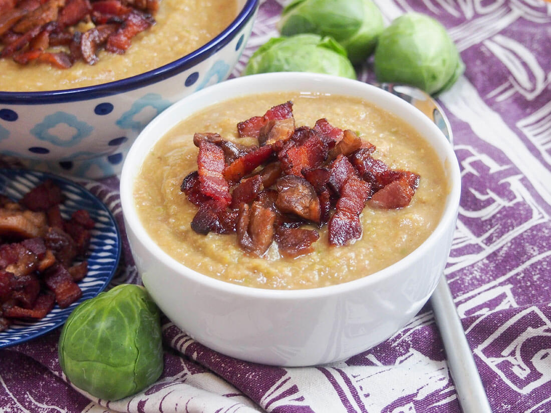 bowl of Brussel sprout soup with crispy bacon and chestnut