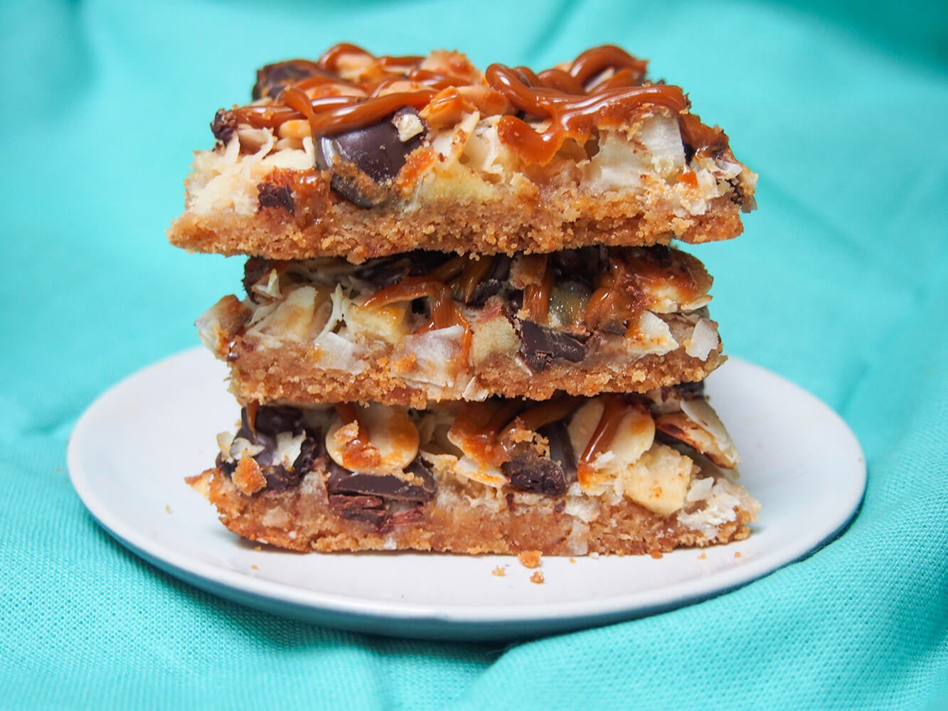 caramel apple magic bars in stack on plate