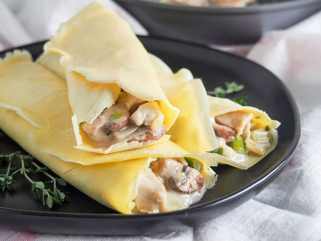 Chicken crepes with leek and mushroom on plate