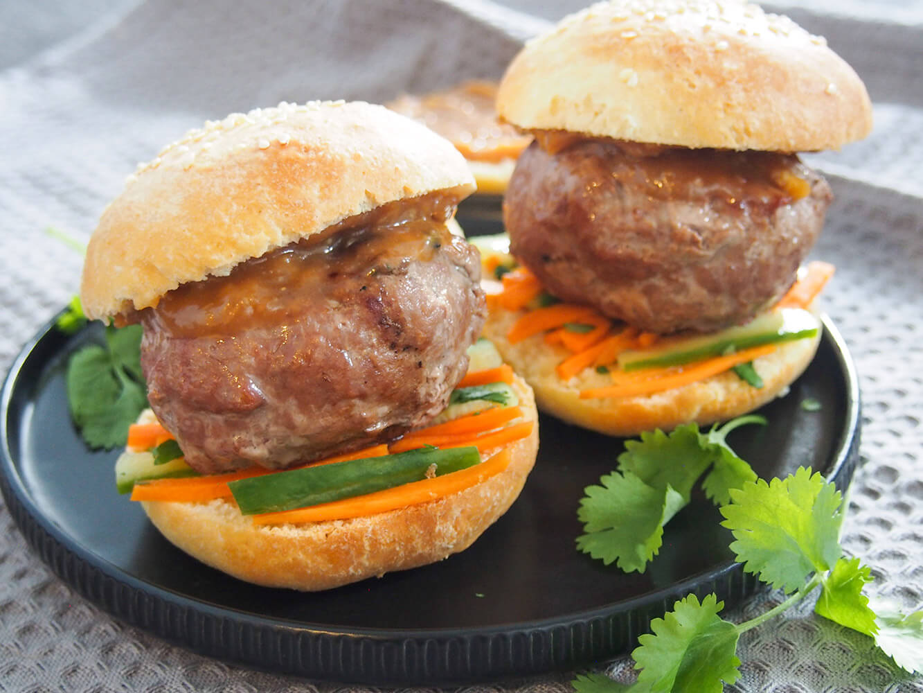 chicken satay burgers on plate