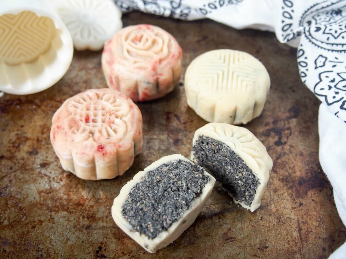 Chinese mooncakes snow skin mooncakes with one cut to front showing filling