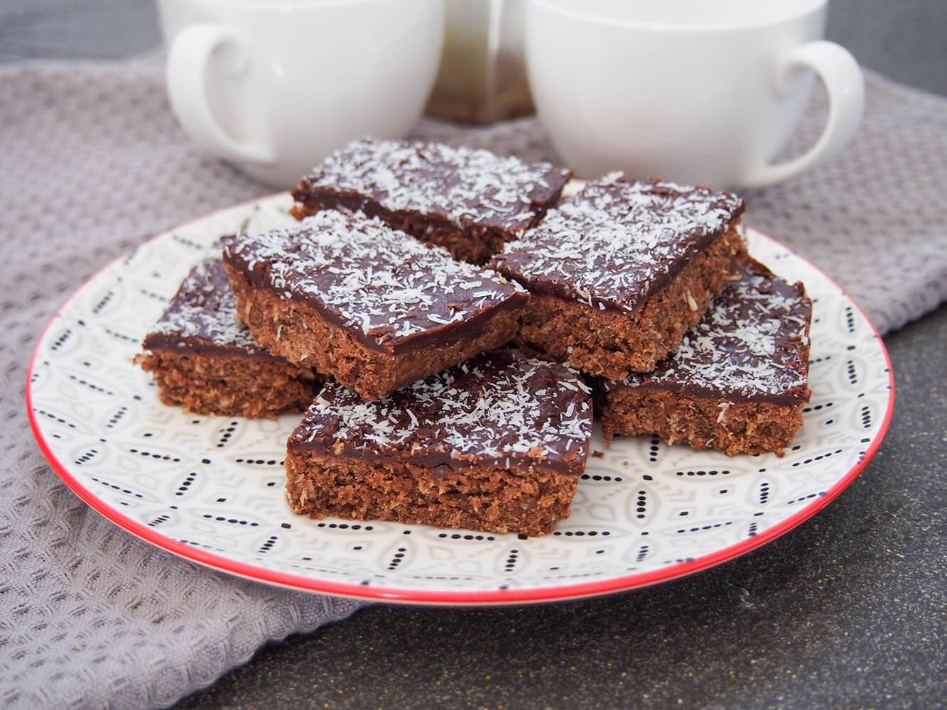 plate of chocolate slice pieces stacked on it