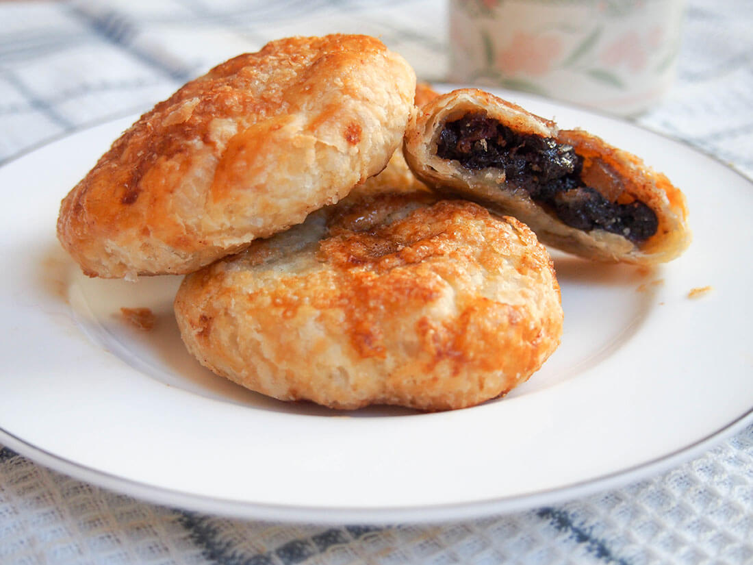 Eccles cakes, British currant pastries, on plate