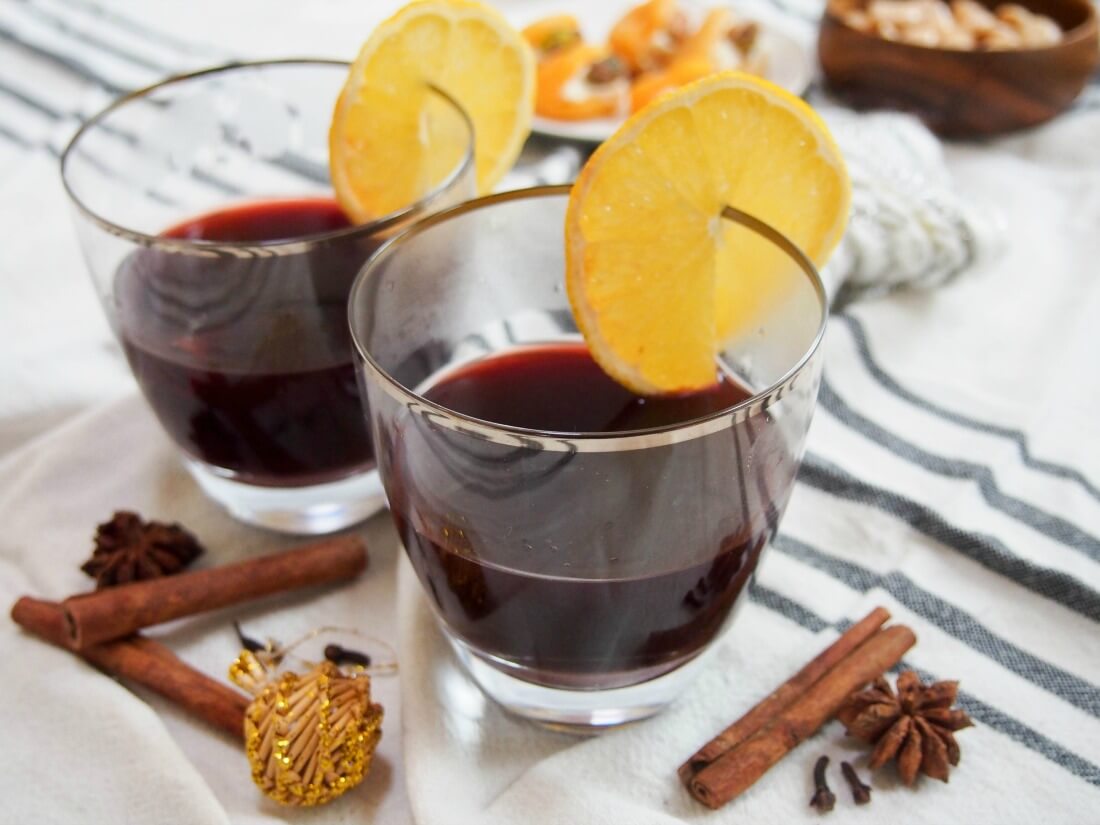 glasses of gluhwein German mulled wine with snacks behind