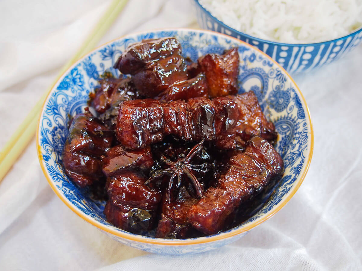 side view of bowl of Hong shao rou red braised pork belly