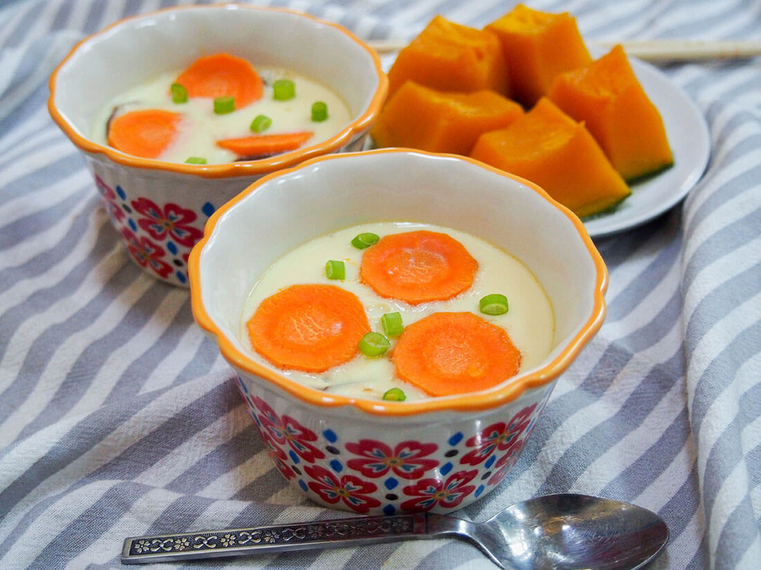 2 dishes of Chawanmushi (Japanese savory egg custard) with some simmered kabocha squash behind