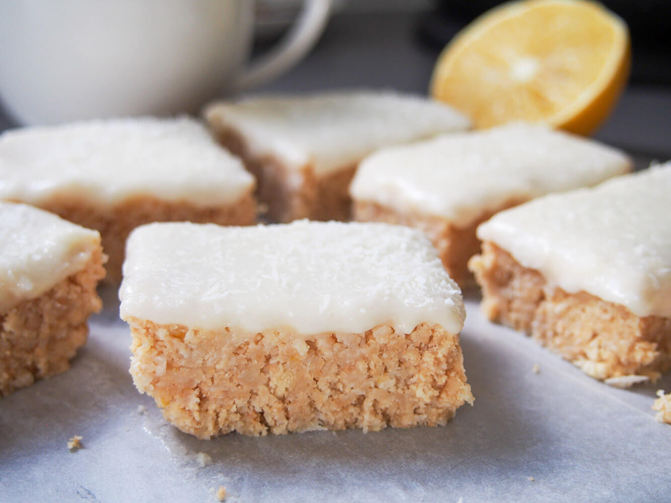 lemon slice pieces with part lemon and coffee mug behind