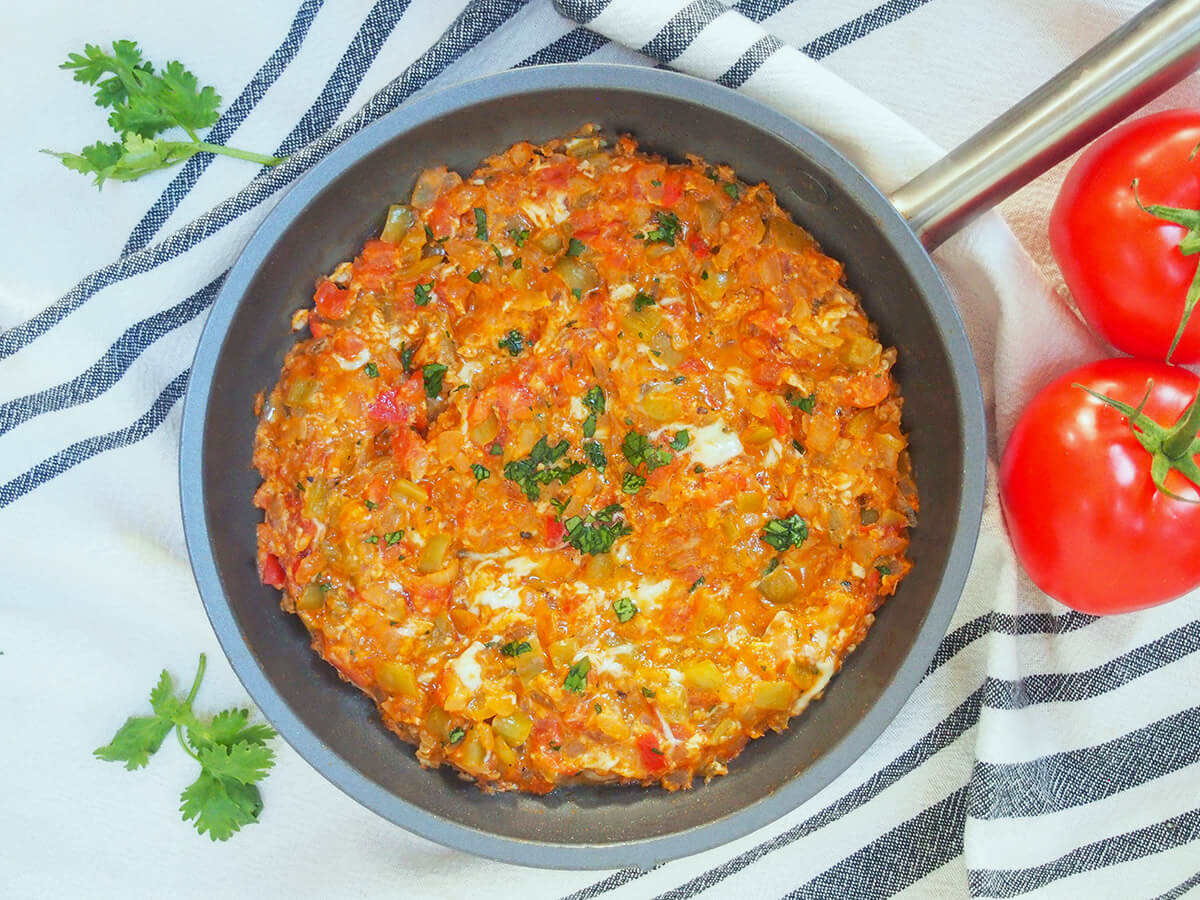 overhead view of skillet full of menemen, Turkish scrambled eggs