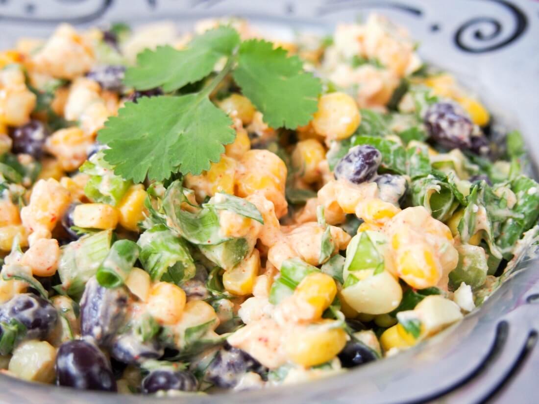 Mexican street corn salad in bowl from side