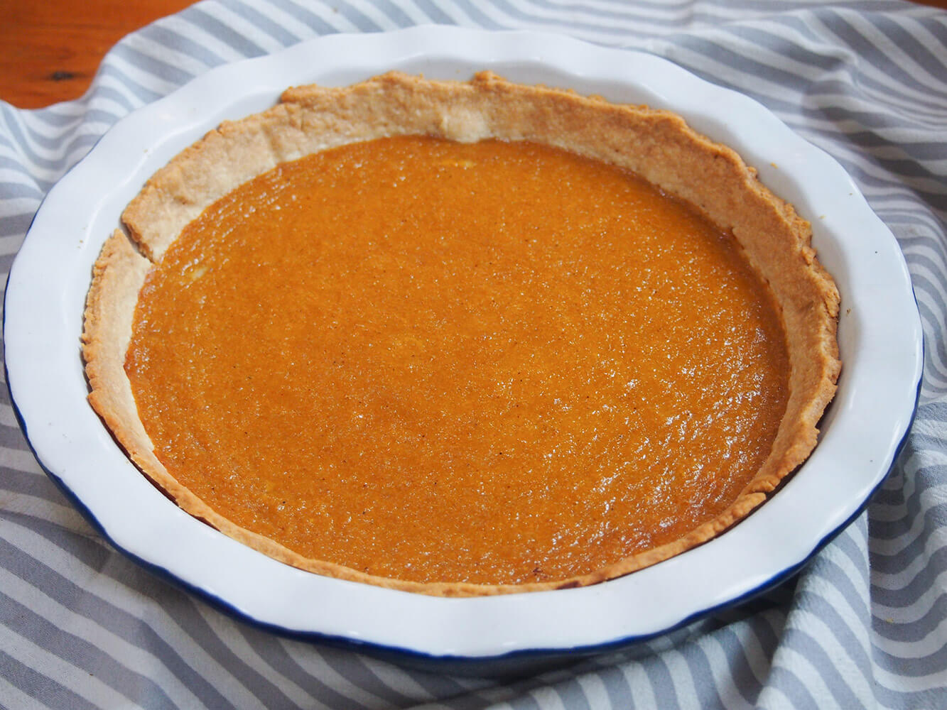 whole pumpkin pie in pie dish