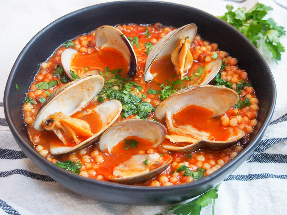 bowl of Sardinian fregola with clams