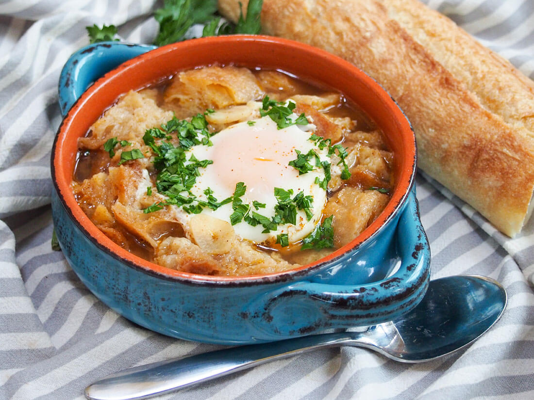 bowl of sopa de ajo with spoon in front