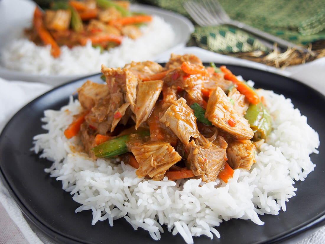 plate of Thai red curry using leftovers, served over rice